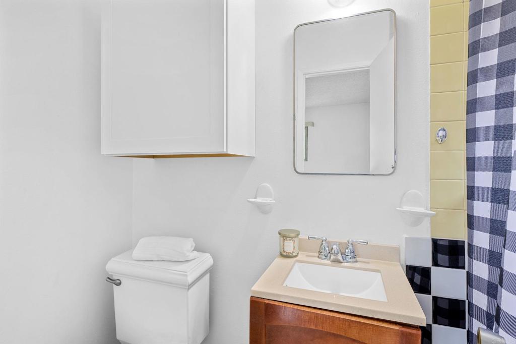 8109 Arlette Street Santee, CA 92071 - Photo 24 of 29 a bathroom with a sink toilet and mirror