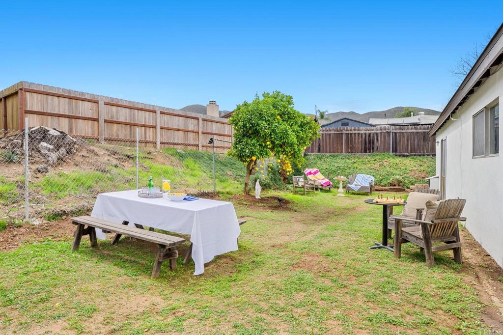 8109 Arlette Street Santee, CA 92071 - Photo 28 of 29 a swimming pool with barbeque oven table and chairs