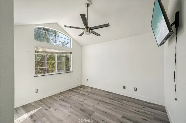 a bathroom with a granite countertop sink mirror vanity and toilet