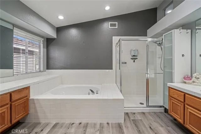 a view of a swimming pool with sitting area