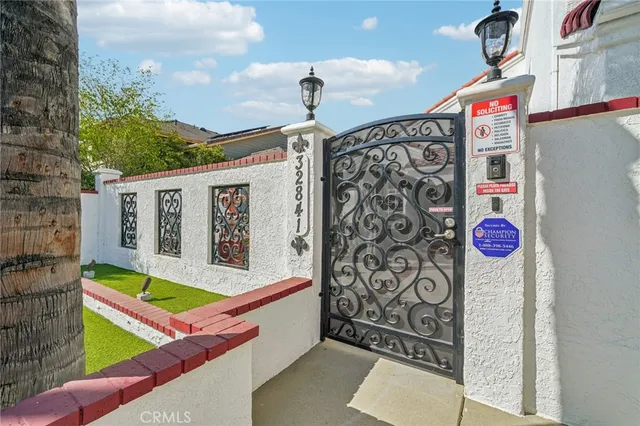 a front view of a house with sign board