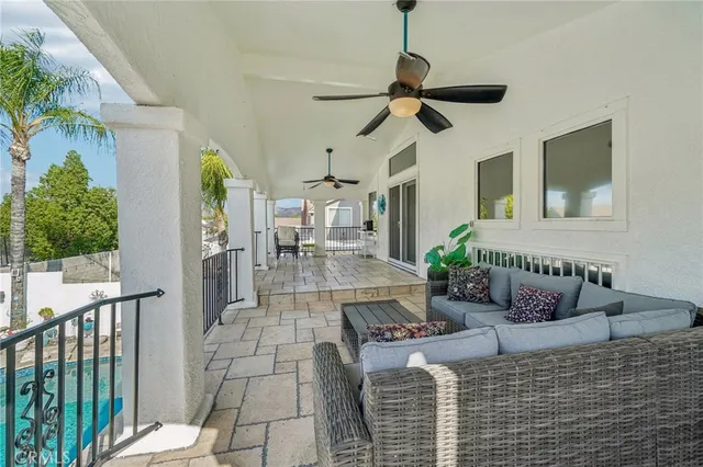 a view of a swimming pool with outdoor seating