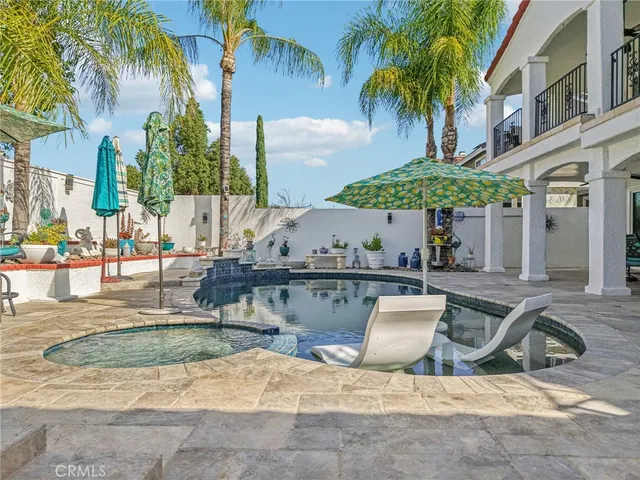 a living room with furniture and flowers