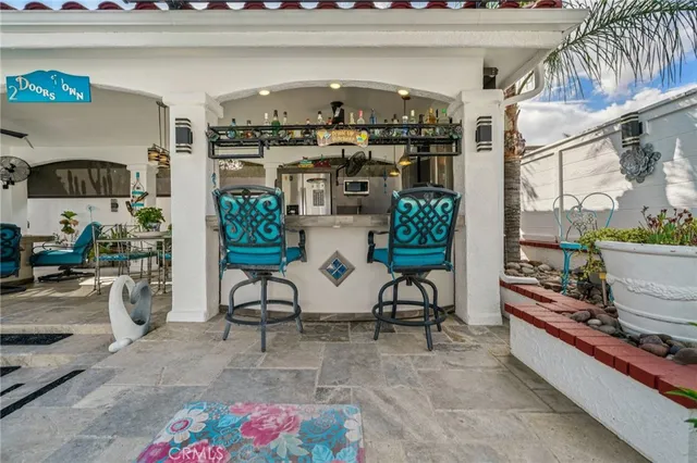 a front view of house with yard and outdoor seating
