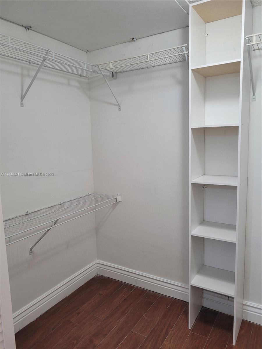 1066 North Hiatus Road, Unit 1066 Pembroke Pines, FL 33026 - Photo 16 of 33 a view of an empty walk in closet