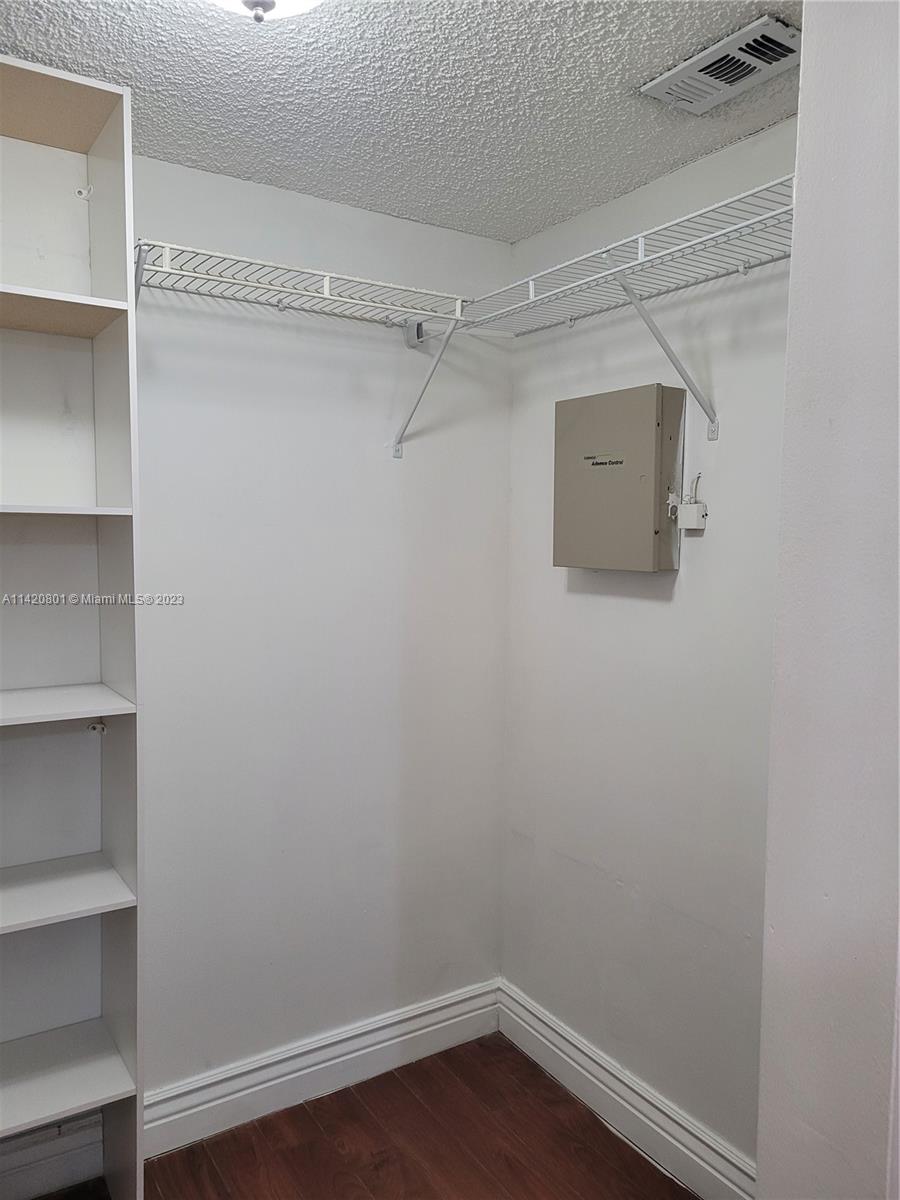 1066 North Hiatus Road, Unit 1066 Pembroke Pines, FL 33026 - Photo 17 of 33 a view of a room with empty racks