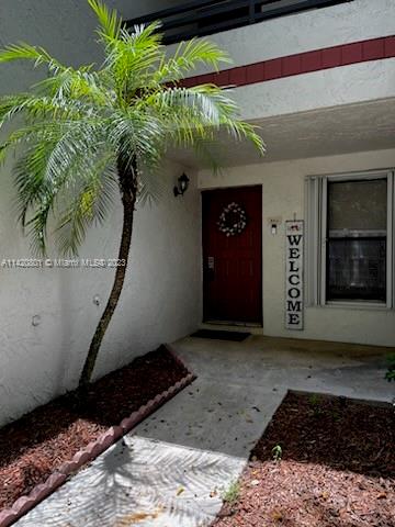 1066 North Hiatus Road, Unit 1066 Pembroke Pines, FL 33026 - Photo 2 of 33 a front view of a house