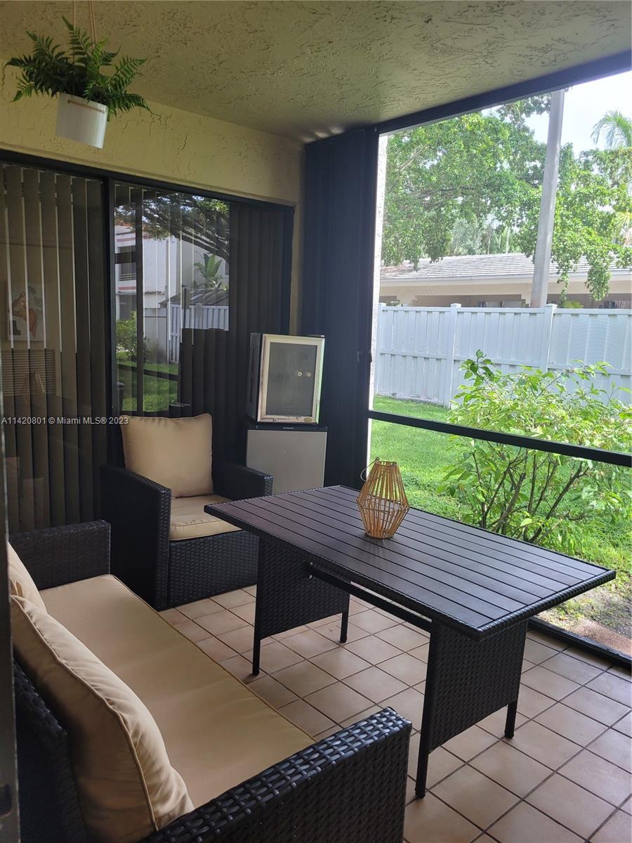 1066 North Hiatus Road, Unit 1066 Pembroke Pines, FL 33026 - Photo 23 of 33 a outdoor view with a sitting space