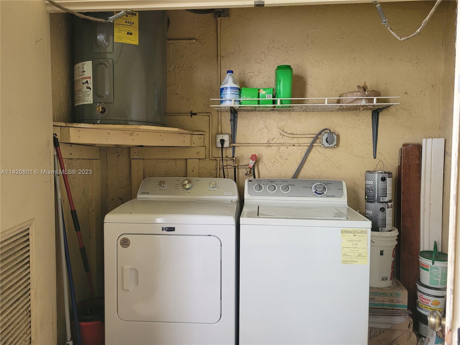 1066 North Hiatus Road, Unit 1066 Pembroke Pines, FL 33026 - Photo 25 of 33 a utility room with dryer and washer