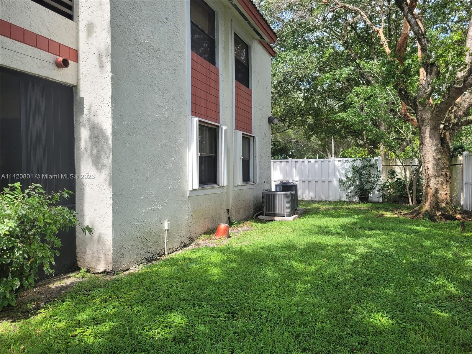 1066 North Hiatus Road, Unit 1066 Pembroke Pines, FL 33026 - Photo 27 of 33 a view of back yard of the house