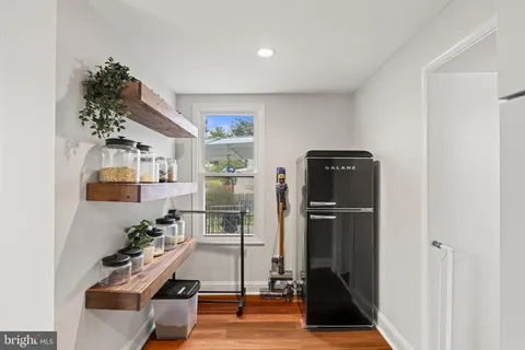 a room with gym equipment and a potted plant