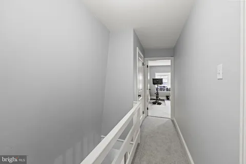a view of hallway with livingroom