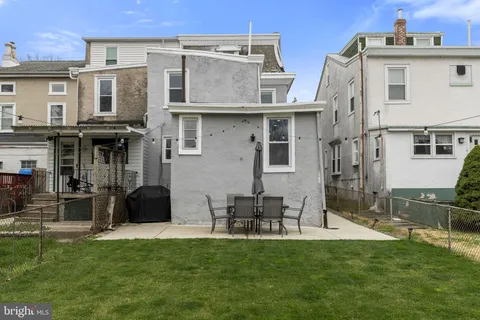 a view of a building with a yard