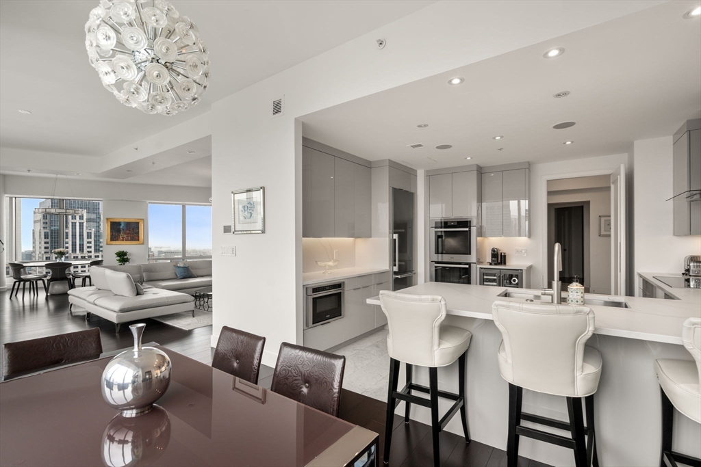 1 Avery Street, Unit PH2B Boston, MA 02111 - Photo 13 of 40 a view of a dining room with furniture and wooden floor