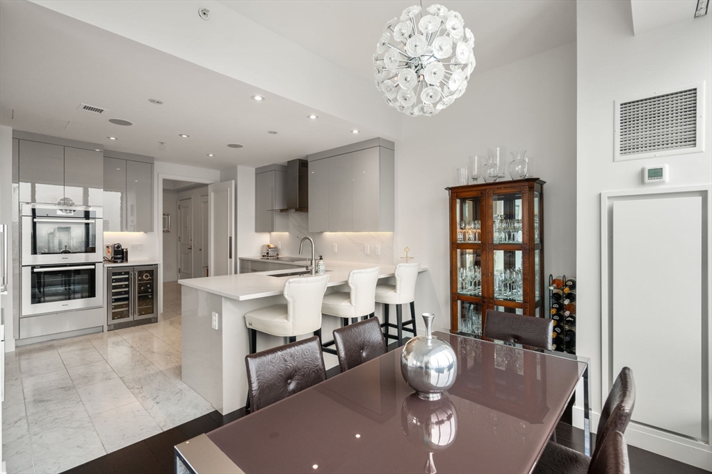 1 Avery Street, Unit PH2B Boston, MA 02111 - Photo 14 of 40 a view of a dining room with furniture