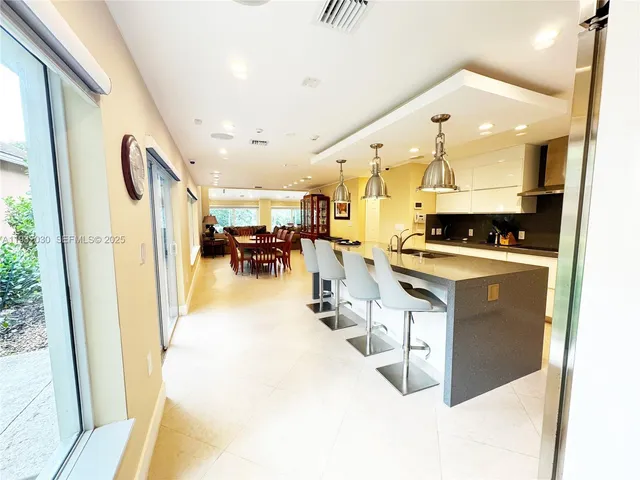 a view of kitchen with furniture and wooden floor