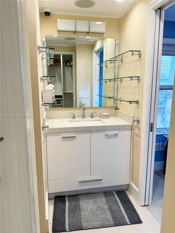 a bathroom with a toilet sink and a shower