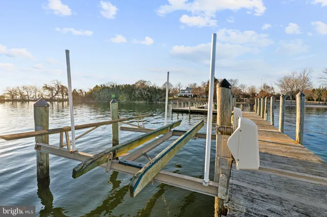 a view of a balcony with wooden floor and iron stairs