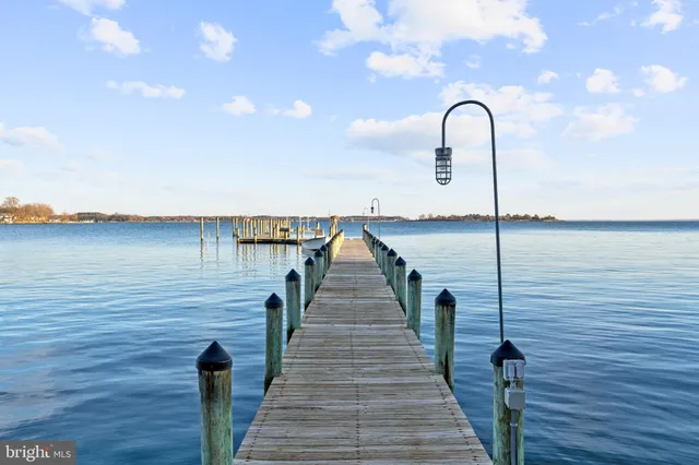a view of a lake with houses in the back