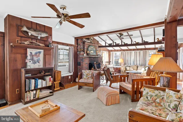 a living room with furniture fireplace and flat screen tv