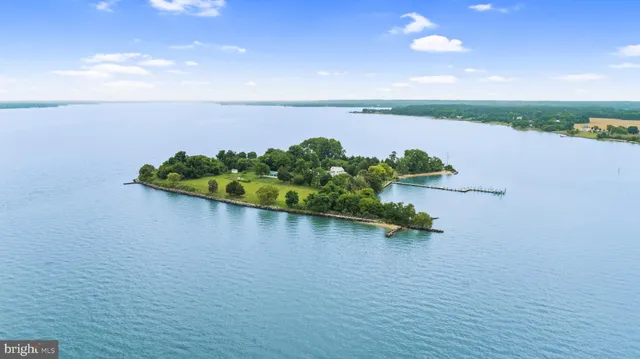 an ocean beach with wooden floor and lake view