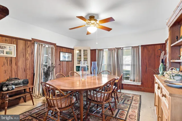 a dining room with furniture window wooden floor