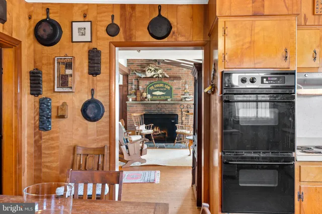 a living room with furniture and a book shelf
