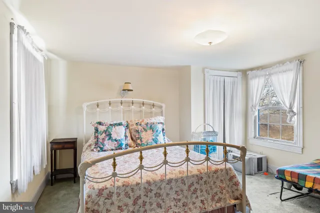 a bathroom with a sink toilet and mirror