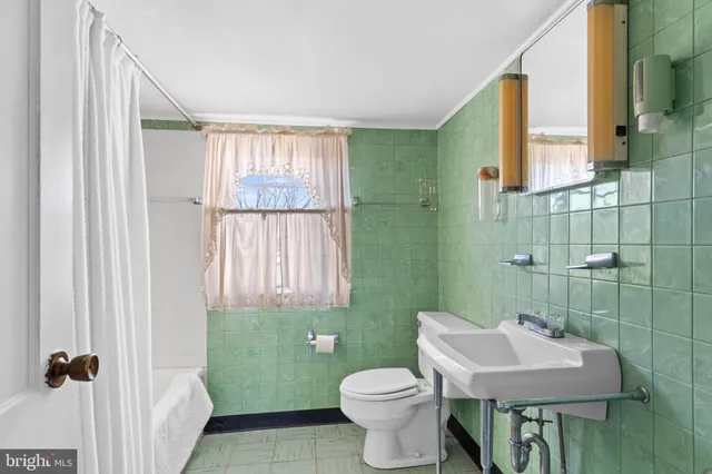 a view of a house with basketball court