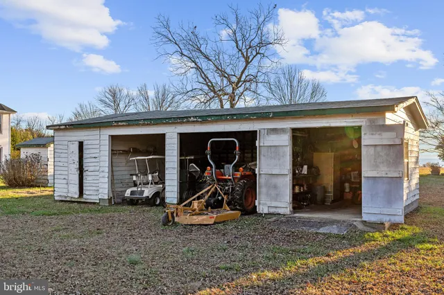 a view of house with outdoor space and garden