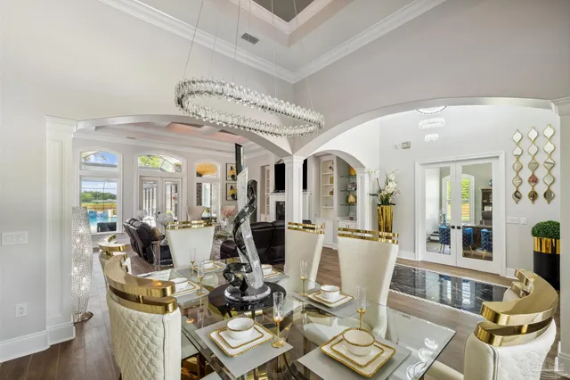 a dining room with furniture and wooden floor