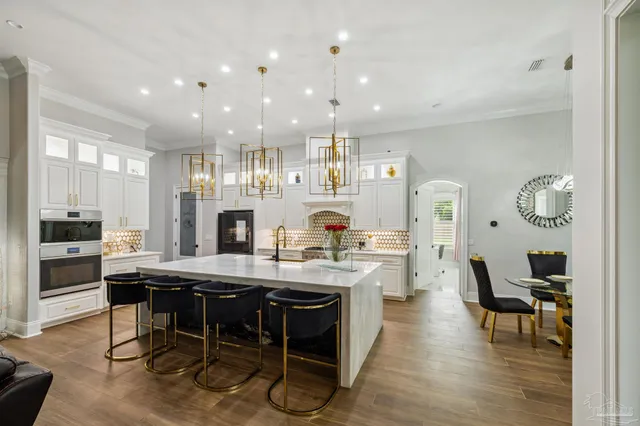 a bed sitting in a spacious bedroom next to a window