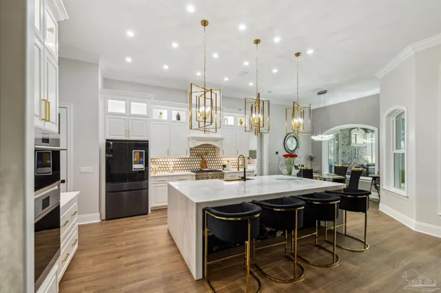 a spacious bedroom with a bed and a flat screen television