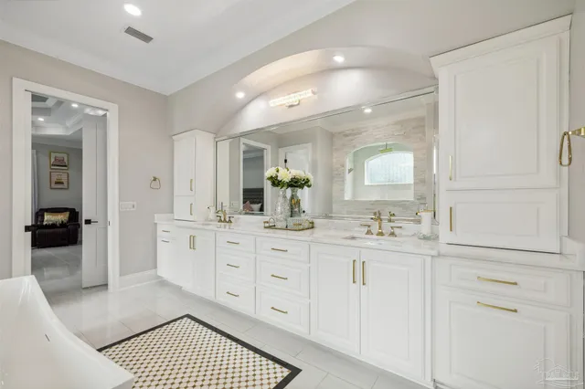 a view of a patio with a table and chairs under an umbrella