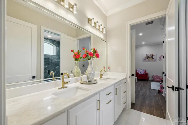 a view of a big patio with table and chairs under an umbrella