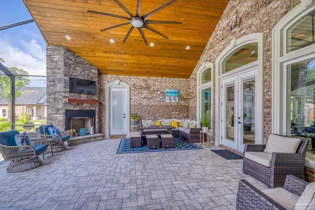 a front view of a house with a yard and potted plants