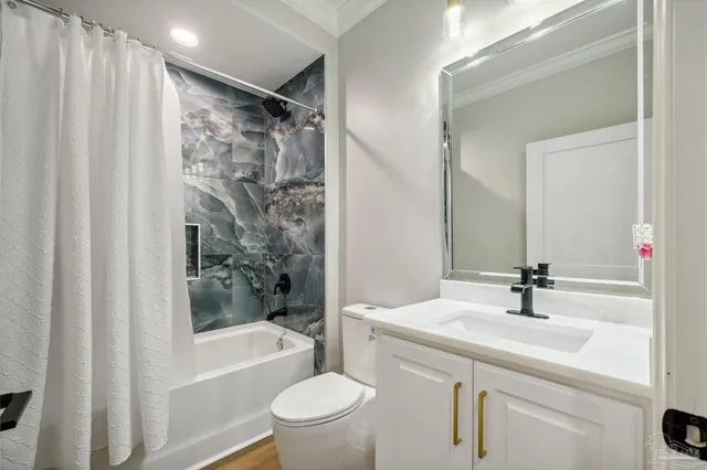 an aerial view of a house with a swimming pool