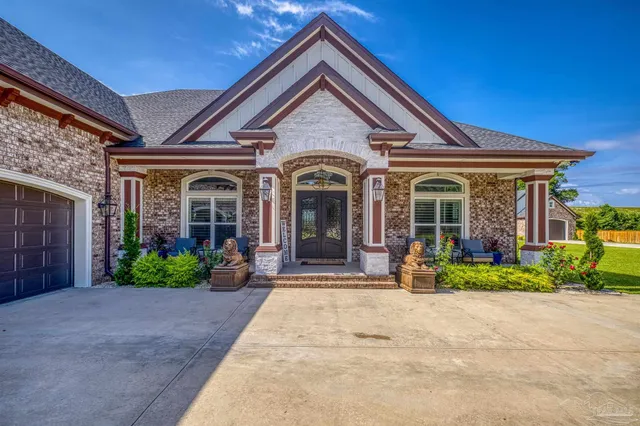 a front view of a house with yard