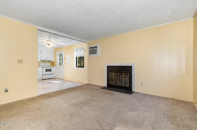 an empty room with a empty space and windows