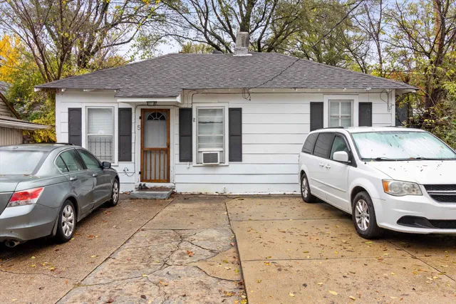a view of a car in front of a house