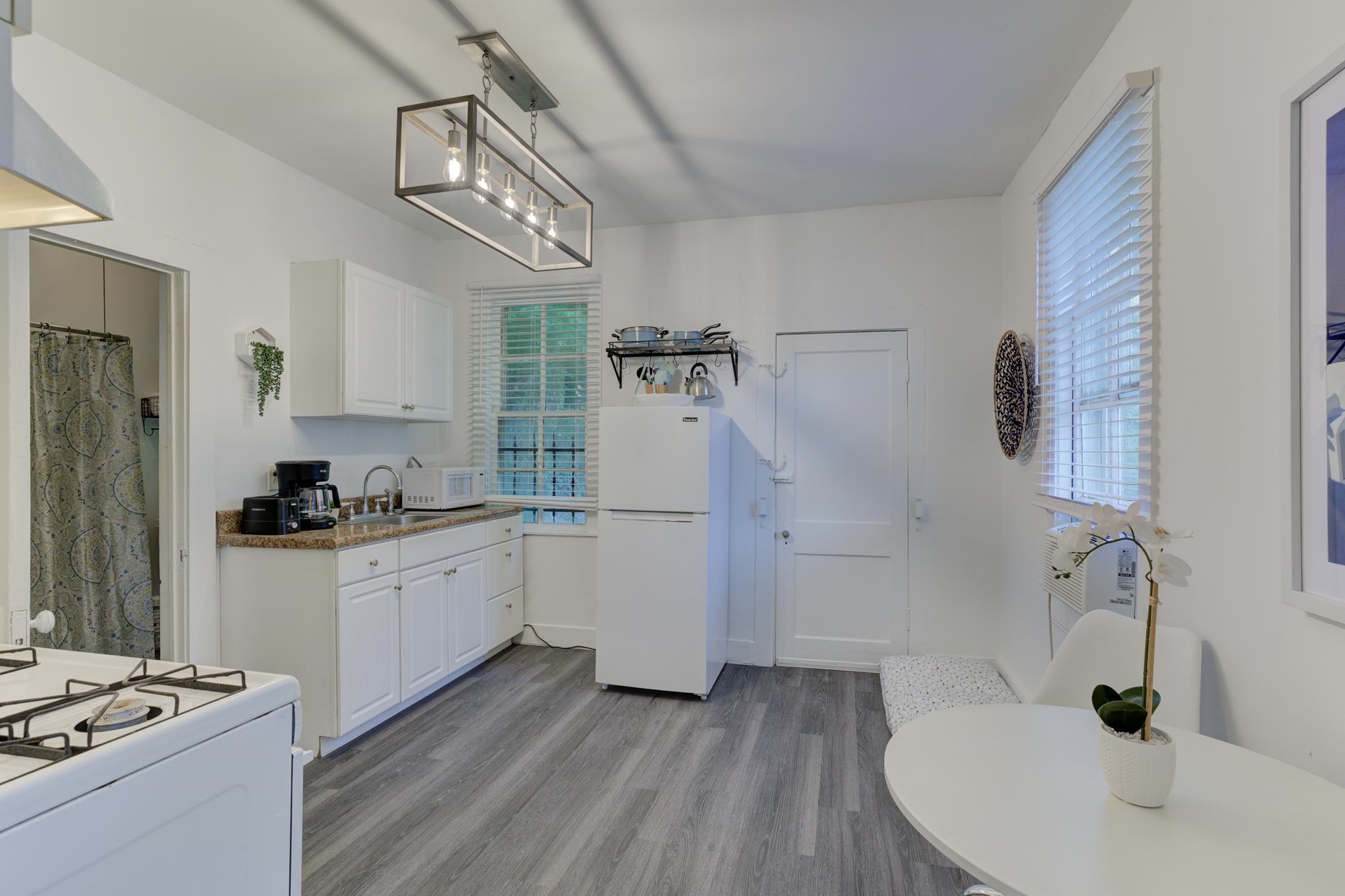 1450 Peabody Avenue Memphis, TN 38104 - Photo 7 of 10 a kitchen with a sink stainless steel appliances and cabinets