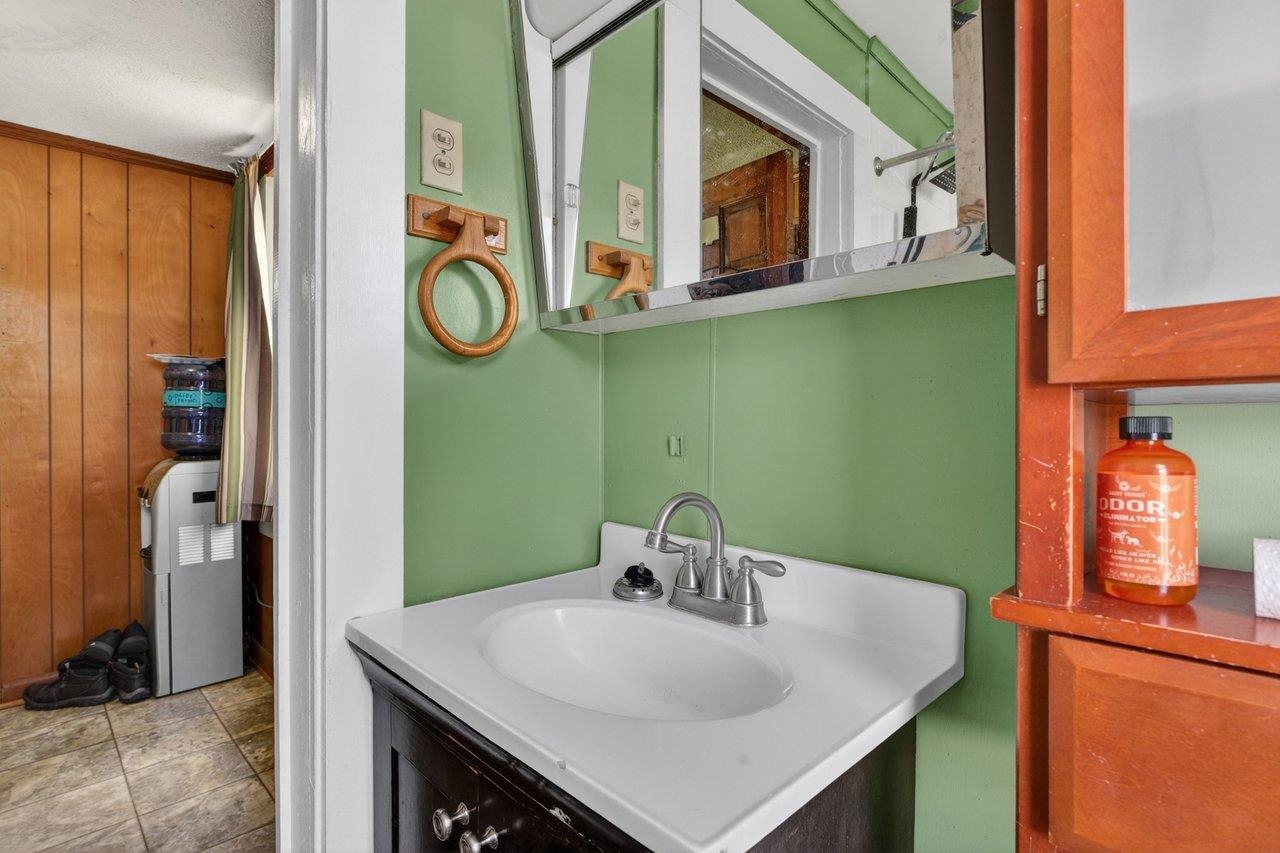 724 Newtown Road Elkton, VA 22827 - Photo 19 of 38 a bathroom with a sink and a mirror