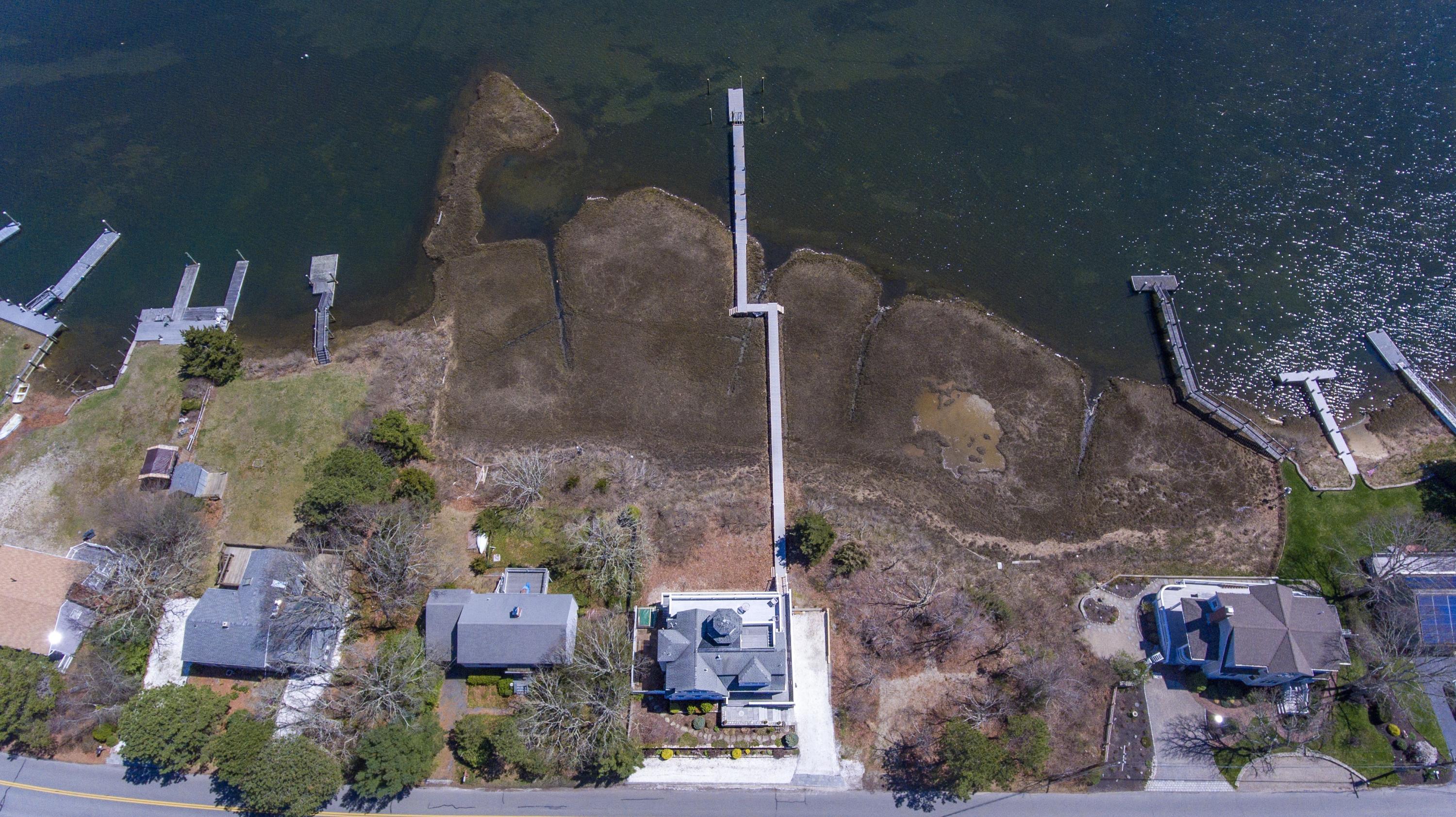 266 Monomoscoy Road Mashpee, MA 02649 - Photo 31 of 35 an aerial view of a house with a yard
