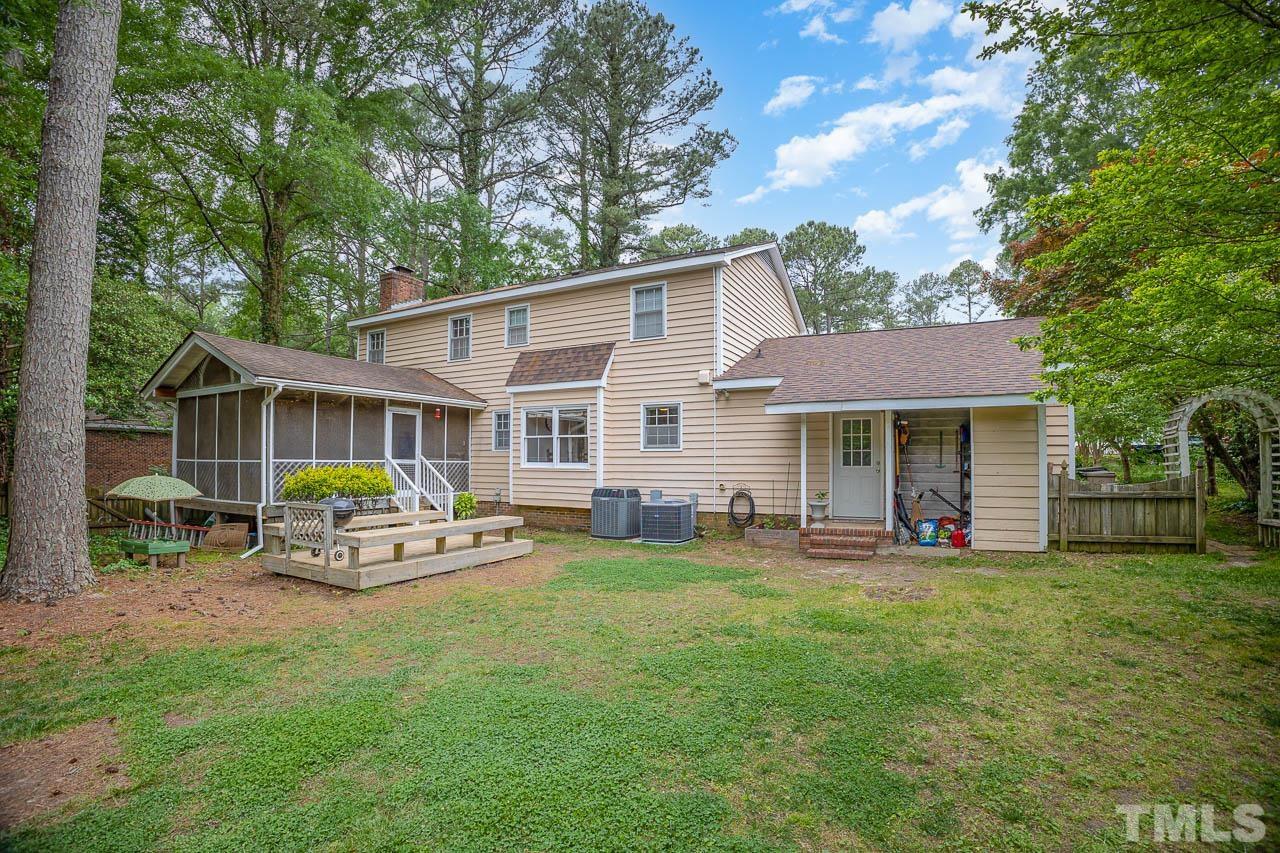 2009 Ryerson Drive Garner, NC 27529 - Photo 3 of 27 a front view of a house with patio and garden