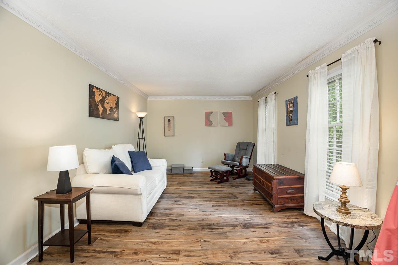 2009 Ryerson Drive Garner, NC 27529 - Photo 9 of 27 a living room with furniture and a table