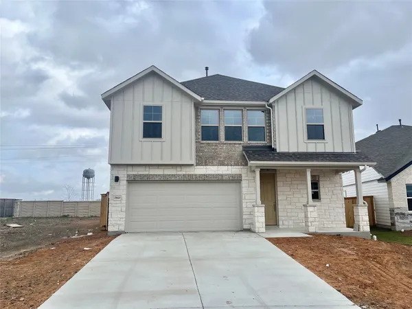a front view of a house with a garage