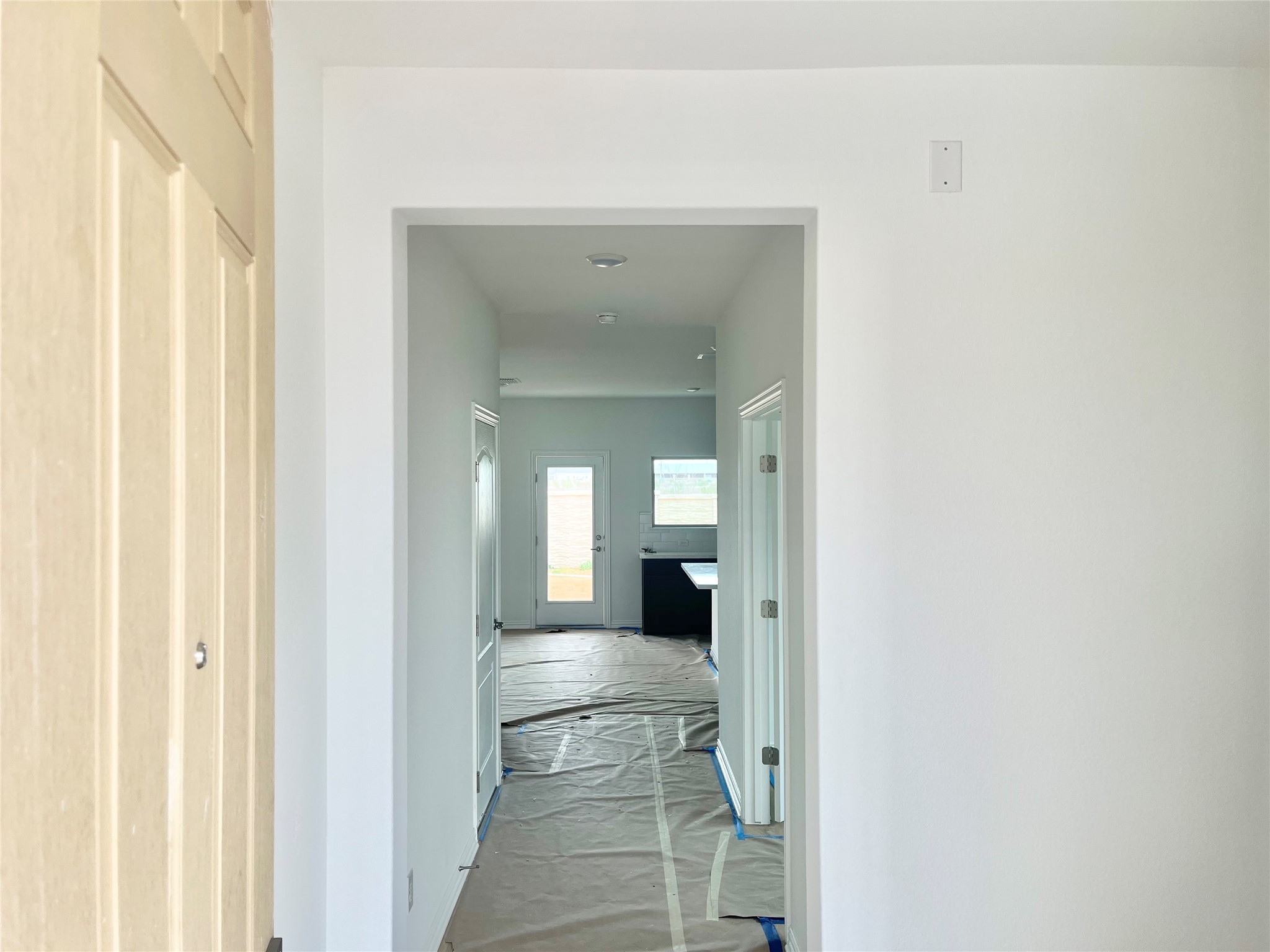25620 Wheat Seed Lane Elgin, TX 78621 - Photo 14 of 14 a view of a hallway with wooden floor
