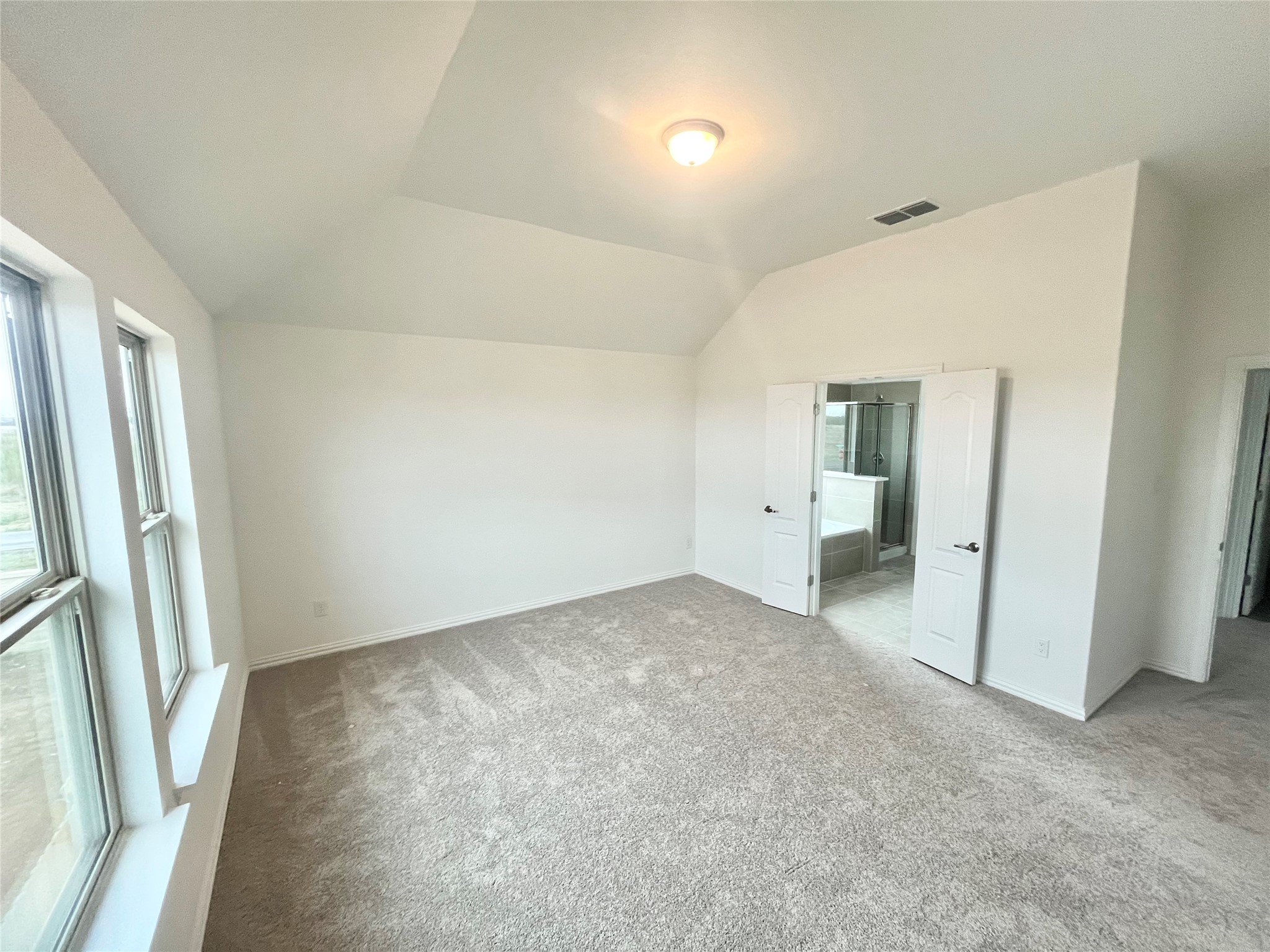 25620 Wheat Seed Lane Elgin, TX 78621 - Photo 8 of 14 an empty room with an entrance to other room