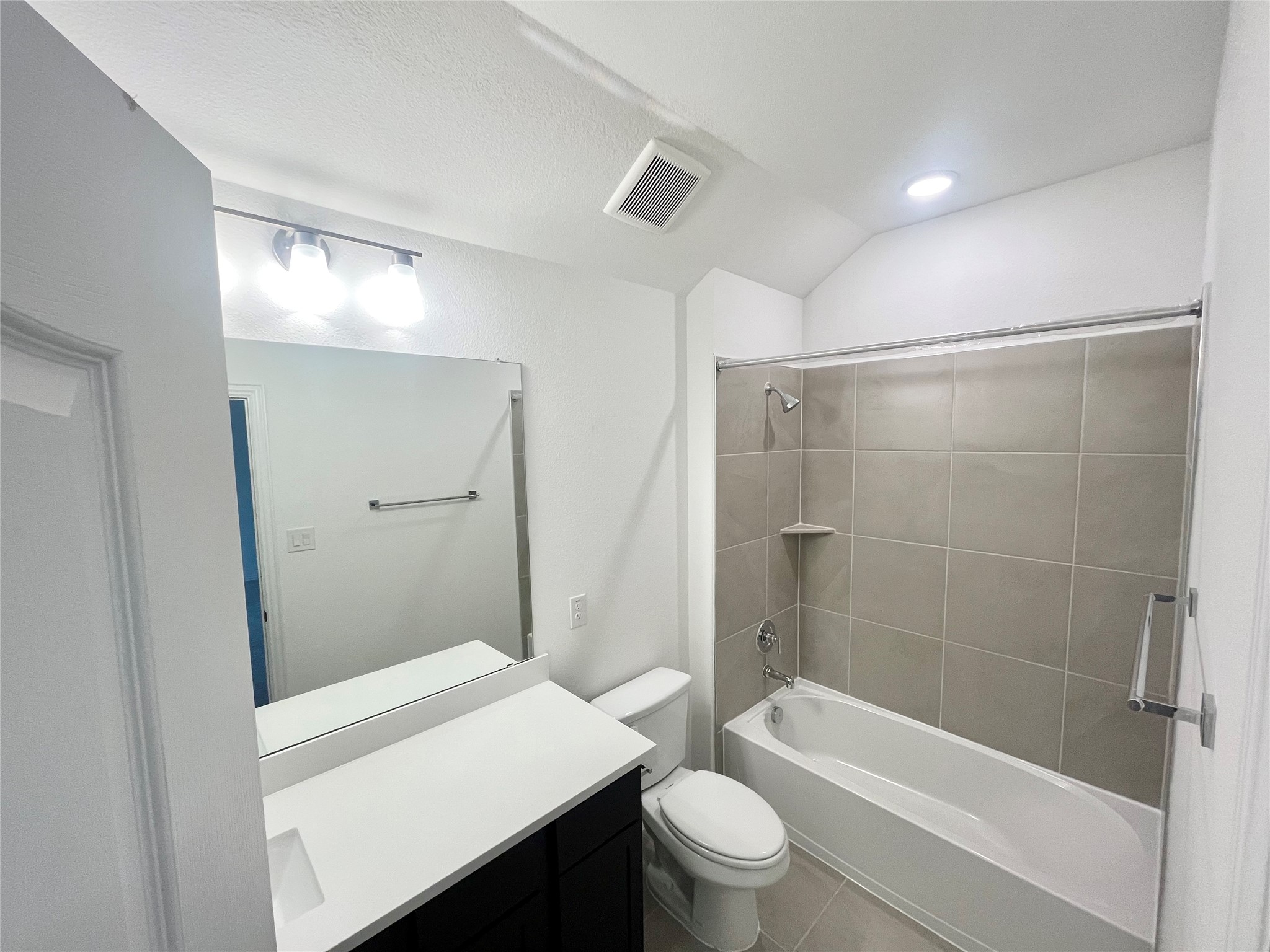 25620 Wheat Seed Lane Elgin, TX 78621 - Photo 10 of 14 a bathroom with a sink a toilet and shower