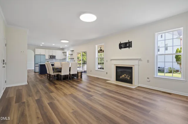 a view of dining room with furniture and fireplace
